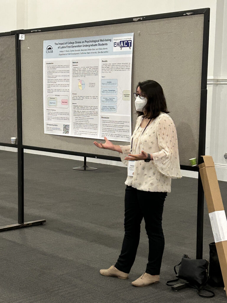 Photo of Imalay at SRA 2023, presenting her poster.